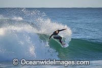 Surfer riding a wave. Emerald Beach, New South Wales, Australia.