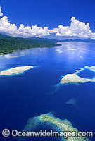 Aerial view of fringing coastal reefs. Kimbe Bay, New Britain Island, Papua New Guinea