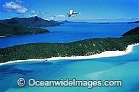 Aerial view of Whitsunday Island beach and Great Barrier Reef excursion float plane. Whitsunday Islands, Queensland, Australia