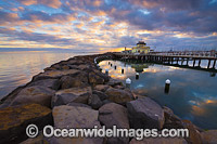 Sunset over the Historic St Kilda Pier and St Kilda Pavilion Kiosk, Port Phillip Bay. Melbourne, Victoria, Australia.