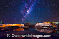The Milky Way pictured over lichen covered granite boulders, situated on the Granite Coast. Bicheno, Tasmania, Australia.