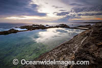 Coastal Seascape, showing sunrise at Blue Pools. Bermagui, New South Wales, Australia.