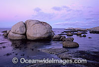 Coastal Seascape. Granite boulder coastline at dusk. False Bay, South Africa