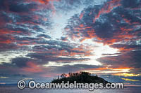 Seascape comprising tropical island and sunset. Whitsunday Islands, Queensland, Australia
