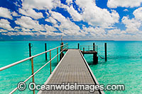 Tropical setting, comprising of jetty, lagoon and sky. Cocos (Keeling) Islands, Indian Ocean, Australia