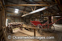 Old horse drawn passenger wagon and dray wagon resting in the historic Kinchega Woolshed, situated in Kinchega National Park, near outback Menindee, New South Wales, Australia.