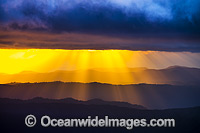 Panorama view of mountains and sunrays at morning sunrise from Point Lookout, on the Great Escarpment situated in Gondwana Rainforest, New England National Park, New South Wales, Australia.
