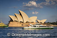 Public transport ferries passing by the Sydney Opera House. Sydney, New South Wales, Australia.