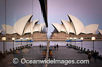 Sydney Opera House reflected on a building glass window. Sydney, New South Wales, Australia.