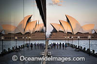 Sydney Opera House reflected on a building glass window. Sydney, New South Wales, Australia.