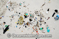 Marine pollution rubbish trash garbage comprising of small plastic pieces, washed ashore by tidal movement on a remote tropical island beach. Cocos (Keeling) Islands, Indian Ocean, Australia