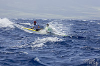 Two man paddle team in the Maui Canoe and Kayak Club's 2024 Maui to Molokai race from DT Fleming Beach to Kaunakakai Harbor, Hawaii.