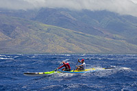 Two man paddle team in the Maui Canoe and Kayak Club's 2034 Maui to Molokai race from DT Fleming Beach to Kaunakakai Harbor, Hawaii.