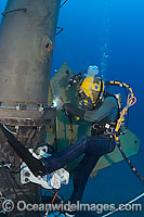 A commercial hard hat diver (MR) welding underwater off Oahu, Hawaii, USA.