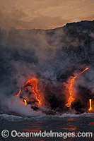 The Pahoehoe lava flowing from Kilauea Volcano has reached the Pacific Ocean at dawn near Kalapana, Big Island, Hawaii.