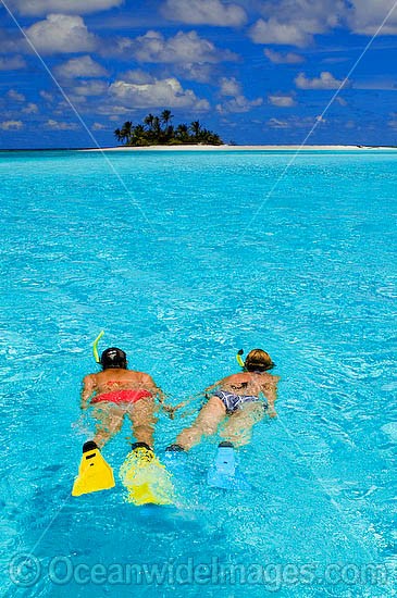 Snorkelers at tropical Island photo