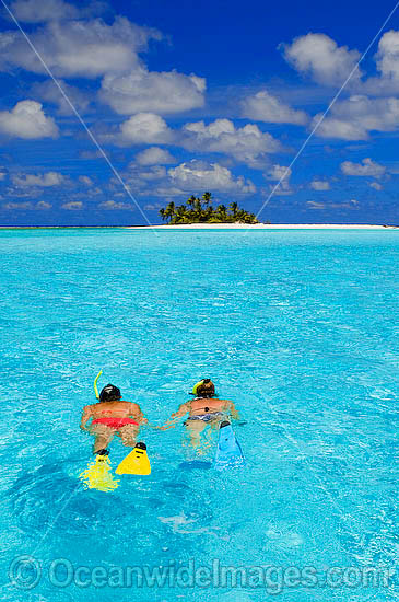 Snorkellers at tropical Island photo Snorkellers at tropical Island photo