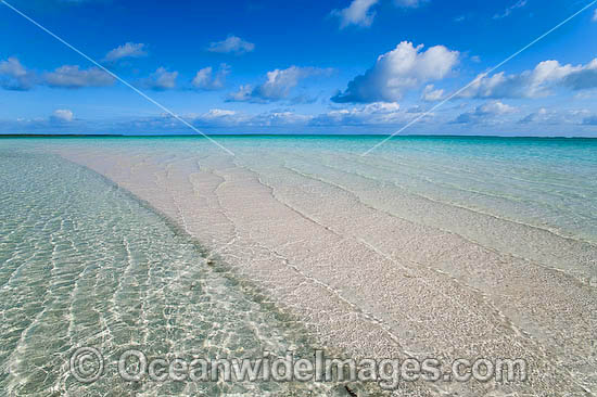 Tidal ripples breaking over a tropical beach sand bar. Cocos (Keeling) Islands, Indian Ocean, Australia Photo - Gary Bell Tidal ripples breaking over a tropical beach sand bar. Cocos (Keeling) Islands, Indian Ocean, Australia Photo - Gary Bell