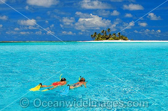 Snorkel divers tropical Island photo