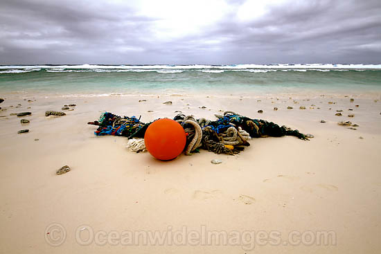 Marine pollution rubbish trash garbage comprising of fishing debris, ropes and floats, washed ashore by tidal movement on a remote tropical island beach. Cocos (Keeling) Islands, Indian Ocean, Australia Photo - Inger Vandyke
