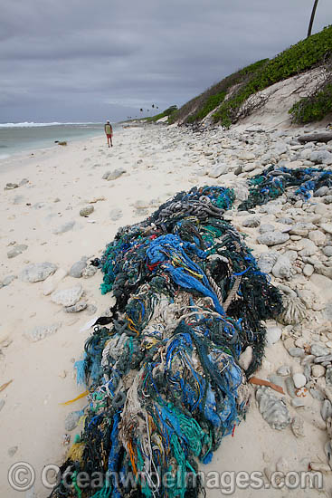 Marine pollution rubbish trash garbage comprising of fishing debris, ropes and nets, washed ashore by tidal movement on a remote tropical island beach. Cocos (Keeling) Islands, Indian Ocean, Australia Photo - Inger Vandyke