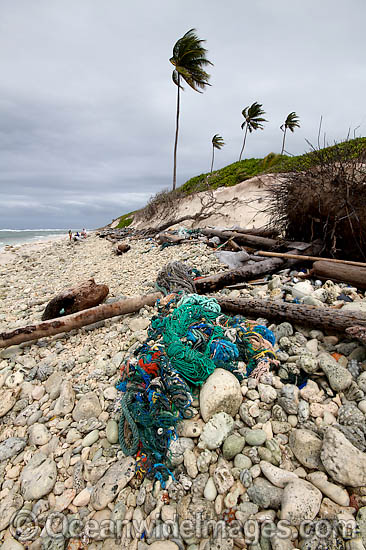 Marine pollution rubbish trash garbage comprising of plastic bottles, footwear and fishing implements, washed ashore by tidal movement on a remote tropical island beach. Cocos (Keeling) Islands, Indian Ocean, Australia Photo - Inger Vandyke Marine pollution rubbish trash garbage comprising of plastic bottles, footwear and fishing implements, washed ashore by tidal movement on a remote tropical island beach. Cocos (Keeling) Islands, Indian Ocean, Australia Photo - Inger Vandyke