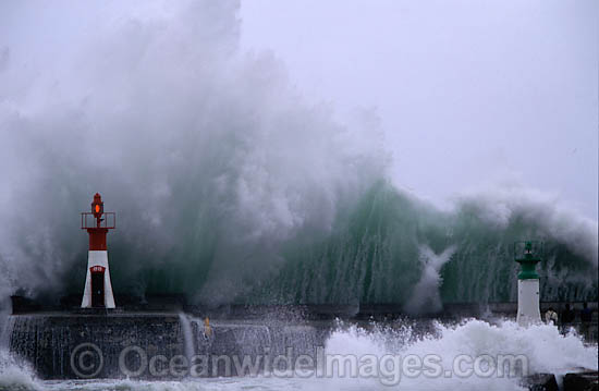 Huge wave breaking against harbor wall during a storm. Kalk Bay, Cape Town, South Africa Photo - Chris and Monique Fallows Huge wave breaking against harbor wall during a storm. Kalk Bay, Cape Town, South Africa Photo - Chris and Monique Fallows
