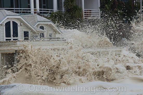 Wave breaking over house photo