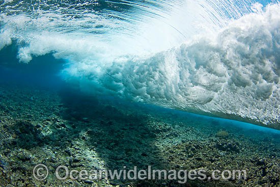 Surf crashing on reef photo