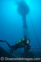 Diver working on Wave Energy Buoy Photo - David Fleetham