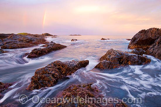 Coastal Seascape with a double rainbow taken at dusk. Sawtell, New South Wales, Australia Photo - Gary Bell