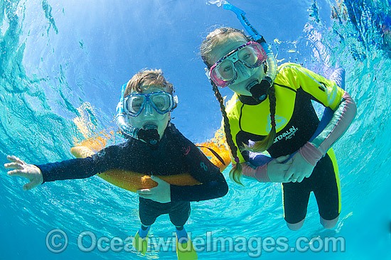 Children Snorkeling in Ocean photo