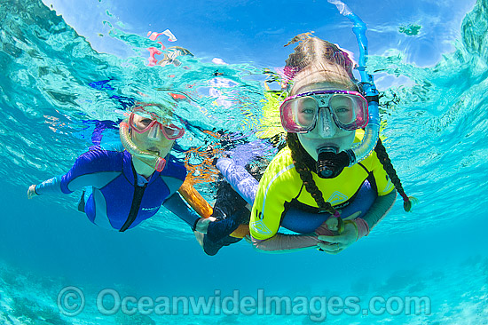 Children with parent snorkel diving on the Great Barrier Reef. Photo taken at Heron Island, Great Barrier Reef, Queensland, Australia. Photo - Gary Bell Children with parent snorkel diving on the Great Barrier Reef. Photo taken at Heron Island, Great Barrier Reef, Queensland, Australia. Photo - Gary Bell