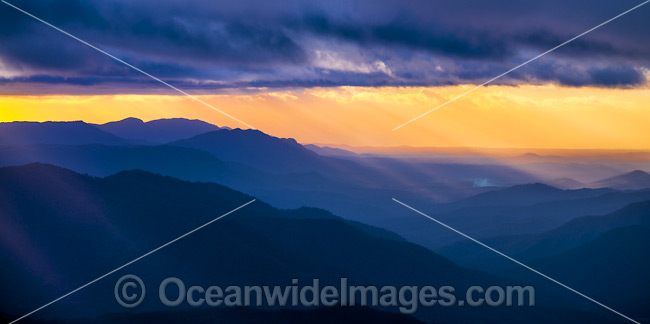 Panorama view of mountains and sunrays at morning sunrise from Point Lookout, on the Great Escarpment situated in Gondwana Rainforest, New England National Park, New South Wales, Australia. Photo - Gary Bell