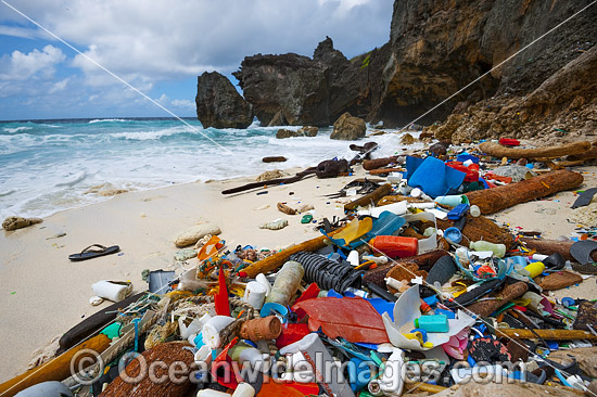 Marine pollution, rubbish trash, garbage comprising of plastic bottles and footwear washed ashore by tidal movement on a remote Christmas Island beach, Indian Ocean, Australia. Drifted from Indonesia. Photo - Gary Bell Marine pollution, rubbish trash, garbage comprising of plastic bottles and footwear washed ashore by tidal movement on a remote Christmas Island beach, Indian Ocean, Australia. Drifted from Indonesia. Photo - Gary Bell
