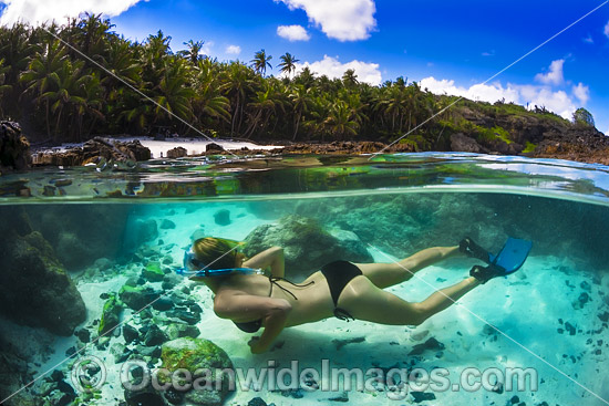 Snorkel diver exploring a tidal rock pool at Christmas Island, Indian Ocean, Australia. Photo - Gary Bell Snorkel diver exploring a tidal rock pool at Christmas Island, Indian Ocean, Australia. Photo - Gary Bell