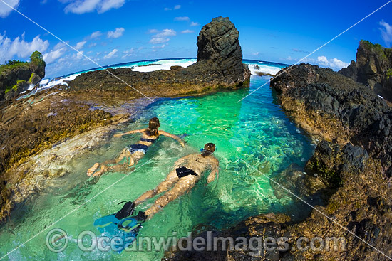 Snorkel divers exploring a tidal rock pool at Christmas Island, Indian Ocean, Australia. Photo - Gary Bell Snorkel divers exploring a tidal rock pool at Christmas Island, Indian Ocean, Australia. Photo - Gary Bell