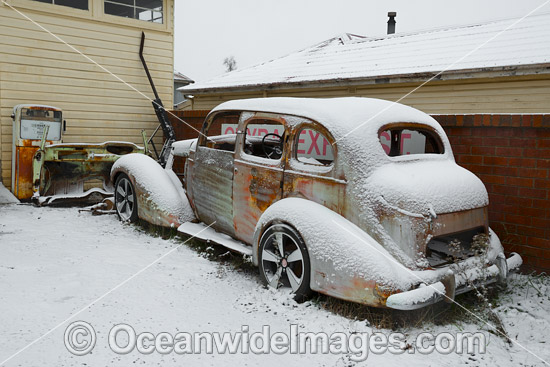 Old car in snow Guyra photo