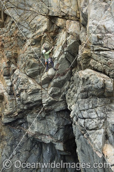 Rock climber, climbing Beowulf Wall, located in Freycinet National Park, Tasmania, Australia. Photo - Gary Bell