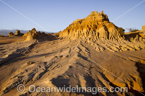 Sunset picture of eroded sand and mud dunes, known as 'Walls of China', situated on the fringe of Lake Mungo. Mungo World Heritage National Park, south-western New South Wales, Australia Photo - Gary Bell