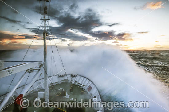 Wave breaking over ship Antarctica photo