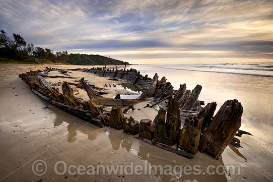 Historic Shipwreck 'Buster' on Woolgoolga beach, New South Wales. Vessel was blown ashore & beached during a violent storm in Feb 1893. Class: Barquentine. Construction: Timber single deck & 3 masts. Built: Nova Scotia, Canada 1884. Length - 129 ft. Photo - Gary Bell