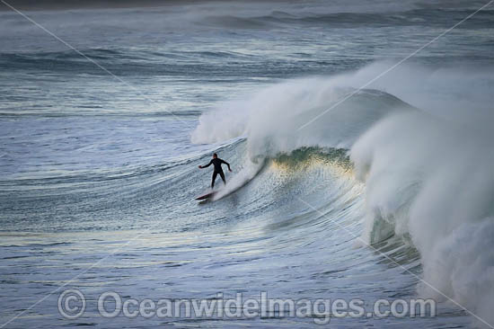 Surfer riding waves photo