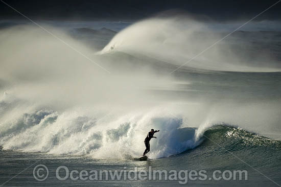 Surfer riding waves photo Surfer riding waves photo