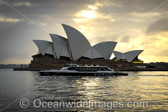 Ferry passing Sydney Opera House photo