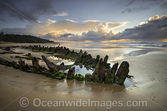Historic Shipwreck 'Buster' on Woolgoolga beach, New South Wales. Vessel was blown ashore & beached during a violent storm in Feb 1893. Class: Barquentine. Construction: Timber single deck & 3 masts. Built: Nova Scotia, Canada 1884. Length - 129 ft Photo - Gary Bell