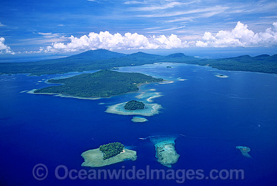 Aerial view of coastal islands and fringing Coral reefs. New Britain Island south coast, Papua New Guinea Photo - Gary Bell
