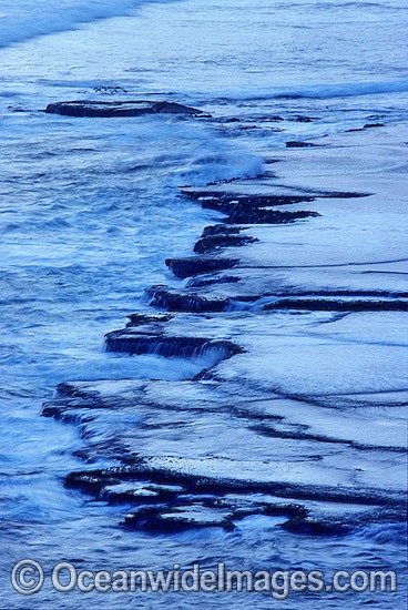water receding off tidal coastal rock photo