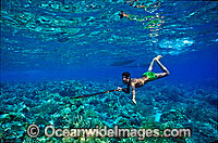 Village Spearfisherman hunting with hand-made speargun. Sumba, Indonesia