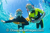 Children snorkel diving on the Great Barrier Reef. Photo taken at Heron Island, Great Barrier Reef, Queensland, Australia.